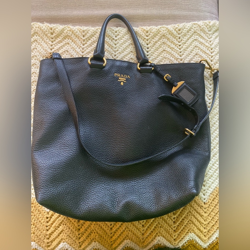 Prada large hobo handbag with adjustable strap.